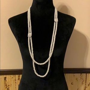 🍀.  Long pearl necklace.